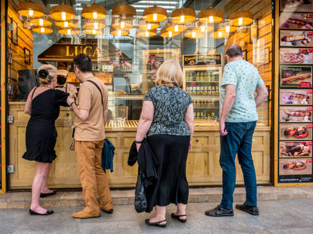 Bucharest/Romania - 05.16.2020: People waiting in line at a pastry shop not respecting the social distancing rule.のeditorial素材