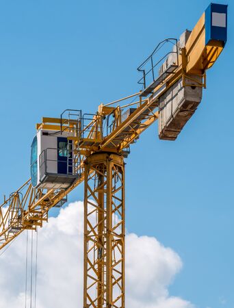 Close up details of a construction crane.Turret Slewing Crane against blue skyの写真素材