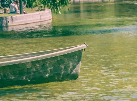 Close up with the front of a boat or a bow on the water of a lake.の写真素材