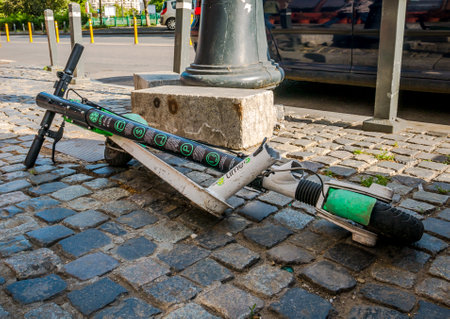 Bucharest/Romania - 05.30.2020: Broken in half Lime electric scooter for rent in the center of Bucharest.のeditorial素材