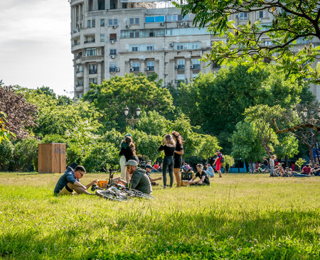 Bucharest/Romania - 05.30.2020: People lying on the grass in the center of Bucharest, enjoying a nice day after Coronavirus lockdown was lifted.のeditorial素材