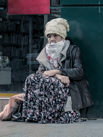 Bucharest/Romania - 05.07.2020: Homeless old woman begging in the center of Bucharest.のeditorial素材
