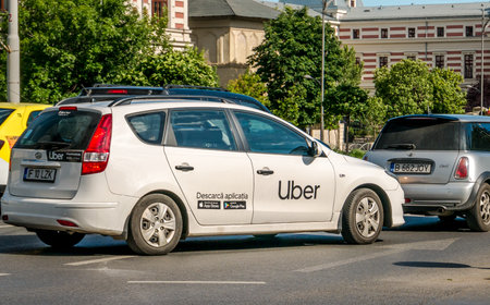 Bucharest/Romania - 05.30.2020: Car with the logo of the ride hailing company Uber in traffic.のeditorial素材