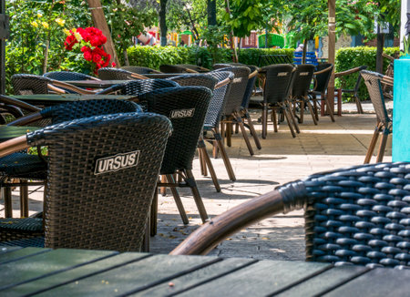 Bucharest/Romania - 03.06.2020:Empty summer terrase in Bucharest. Chairs and tables with the logo of Ursus beer, made in Romaniaのeditorial素材