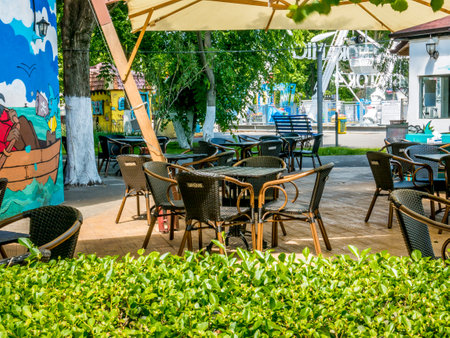 Bucharest/Romania - 03.06.2020:Empty summer terrase in Bucharest. Chairs and tables with the logo of Ursus beer, made in Romaniaのeditorial素材