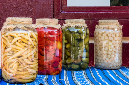 Jars of homemade traditional romanian vegetables , pickles.