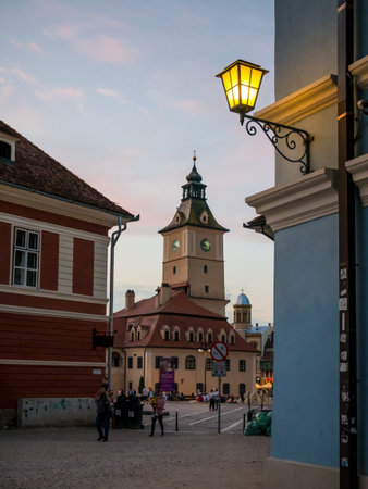 Brasov/Romania - 06.28.2020: Brasov city hall building located in the old town Council Square. Brasov's main square at sunset or night.のeditorial素材