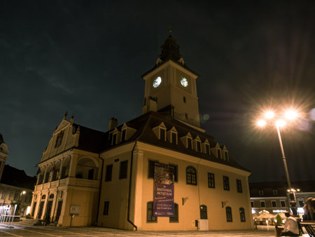Brasov/Romania - 06.28.2020: Brasov city hall building located in the old town Council Square. Brasov's main square at sunset or night.のeditorial素材