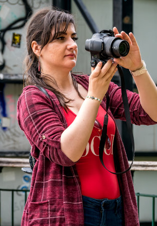 Brasov/Romania - 06.28.2020: Girl taking a picture with SONY Cyber-Shot DSC-HX350 camera on mount Tampa.のeditorial素材