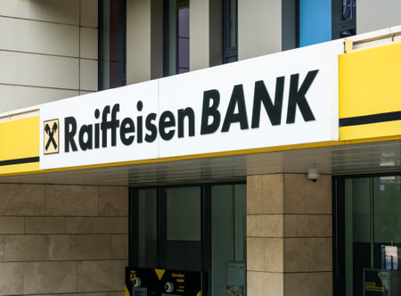 Bucharest/Romania - 07.18.2020: Raiffeisen bank logo at the entrance of a branch in Bucharestのeditorial素材