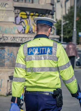 Bucharest/Romania - 10.17.2020: Rear view of a romanian police officer in uniform.