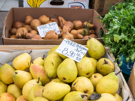 Bucharest/Romania - 11.20.2020: Bartlett pears with prices in romanian currency on display in a fruits and vegetables market in Romaniaのeditorial素材