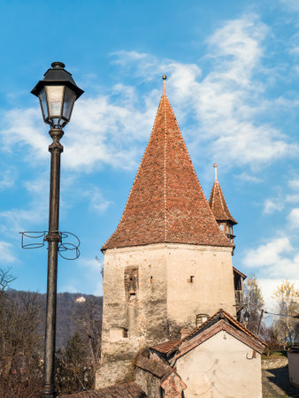 Sighisoara Romania - 11.26.2020: View of the Bootmakers' Tower (Turnul Cizmarilor) located in the north-east of SighiÅoara citadel.のeditorial素材
