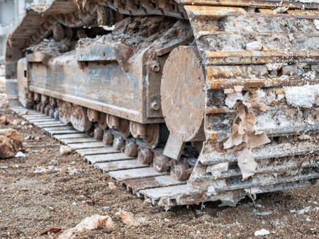 Close up detail with chain tracks of a bulldozer on a demolition siteの写真素材