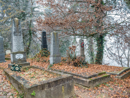 Sighisoara Romania - 11.26.2020: Graves and tombstones in the cemetery located near Church on the Hill in Sighisoara.のeditorial素材
