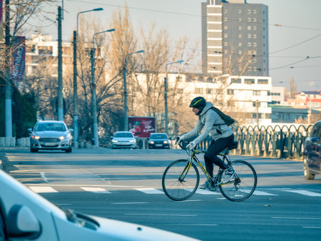 Bucharest,Romania - 01.01.2021: Man in the intersection riding a bicycleのeditorial素材