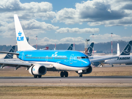 Otopeni, Romania - 01.23.2021: A KLM Royal Dutch Airlines Boeing 737-7K2 (PH-BGP) airplane on the airport runway at Henri Coanda International Airport.のeditorial素材