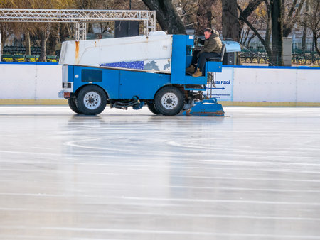 Bucharest, Romania - 02.12.2021: Ice resurfacer smoothing and polishing the surface of the Cismigiu ice rinkのeditorial素材