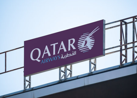 Bucharest, Romania - 03.13.2021: Qatar Airways board sign logo on the roof of a building in Bucharest. Qatar Airways is the state-owned flag carrier of Qatarのeditorial素材