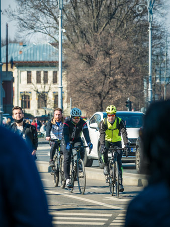 Bucharest, Romania - 03.13.2021: Cyclists riding bicycles on the busy streets of Bucharestのeditorial素材