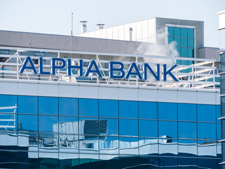 Bucharest, Romania - 03.18.2021: Alpha bank logo on a office building in Bucharest. Alpha Bank is the second largest Greek bankのeditorial素材