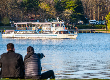 Bucharest, Romania - 03.26.2021: Tourist boat on the lake of King Mihai I Park (Herastrau).のeditorial素材