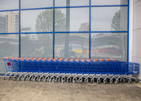 Many aligned shopping carts at the hypermarketの写真素材