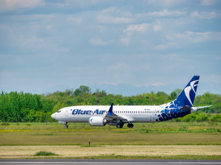Otopeni, Romania - 05.15.2021: Blue Air Boeing 737 MAX 8airplane on the airport runway at Henri Coanda International Airport.のeditorial素材