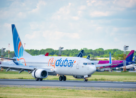 Otopeni, Romania - 05.15.2021: A Fly Dubai Boeing 737-8KN (A6-FEP) airplane on the airport runway at Henri Coanda International Airport.のeditorial素材