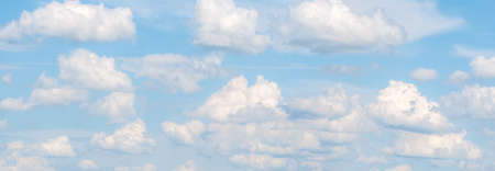 Panoramic picture with Fluffy White Clouds on a blue sky.の写真素材