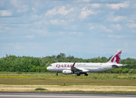 Otopeni, Romania - 05.08.2021: Qatar Airways Airbus A320-232 (A7-AHT) on the airport runway at Henri Coanda International Airport.のeditorial素材