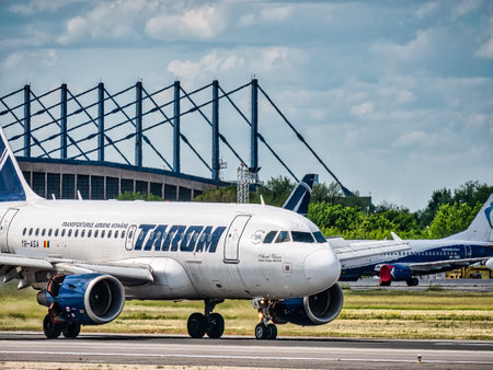 Otopeni, Romania - 05.15.2021: A Tarom Boeing 737-78J (YR-BGF) airplane on the airport runway at Henri Coanda International Airport.のeditorial素材