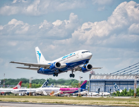 Otopeni, Romania - 05.14.2021: Blue Air Boeing 737-5L9 (YR-BAG) airplane takes off from Henri Coanda International Airportのeditorial素材