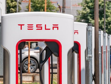 Timisoara, Romania - 06.19.2021: Tesla Supercharger stall station with parking space and cable-outletsのeditorial素材