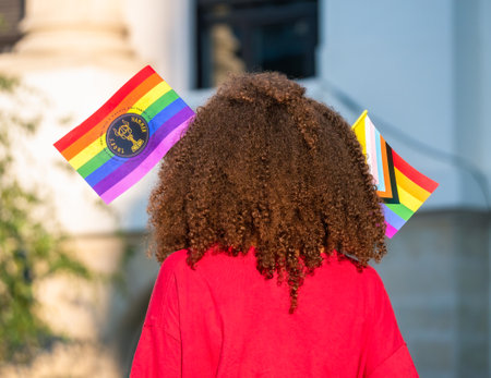 Woman or girl wearing the The rainbow flag, symbol of LGBT andのeditorial素材
