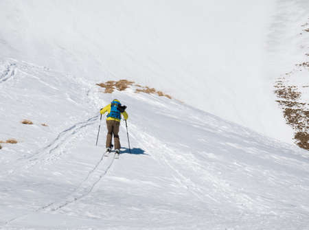 Skier enjoying skiing in a remote area of the Bucegi Mountains in Romaniaの写真素材