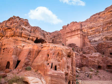 Tomb of 'Unayshu a well preserved tomb carved in red rock in the ancient city of Petra, Jordanの写真素材