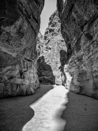 Picture with al-Siq, the natural passage through red rock walls which is main entrance to the ancient Nabatean city of Petra in southern Jordan.の写真素材