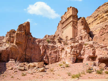 Tomb of 'Unayshu a well preserved tomb carved in red rock in the ancient city of Petra, Jordanの写真素材