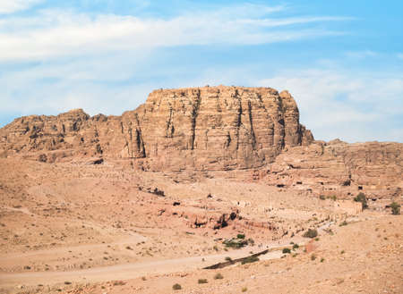 Aerial scene from the ancient city of Petra, Jordan. View of the Colonnaded Street and a massive rock red mountain in the backgroundの写真素材