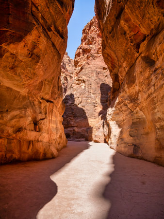 Picture with al-Siq, the natural passage through red rock walls which is main entrance to the ancient Nabatean city of Petra in southern Jordan.の写真素材