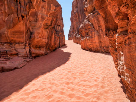 Abu Khashaba narrow gorge canyon in Wadi Rum red rock desert, Jordan.の写真素材