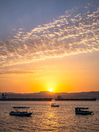 Scenic view at sunset from Aqaba Port , Jordan. Sunset on the Red Seaの写真素材