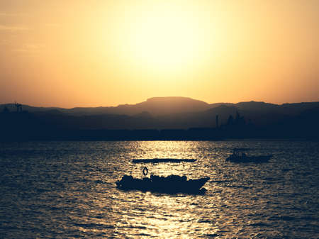 Scenic view at sunset from Aqaba Port , Jordan. Sunset on the Red Seaの写真素材