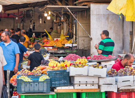 Amman, Jordan - 09.02.2021: Fresh fruit market in Amman, Jorda. Outdoor market with tropical fruits on displayのeditorial素材