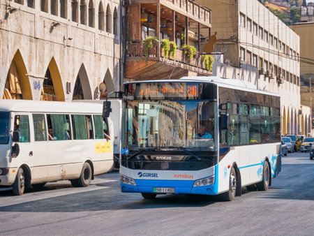 Amman, Jordan - 09.02.2021: Otokar public bus transport on the streets of Amman city, Jordanのeditorial素材
