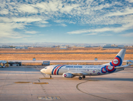 Amman, Jordan - 09.02.2021:A Jordan Aviation Boeing 737-300 airplane on the airport runway at Queen Alia International Airport, Amman.のeditorial素材