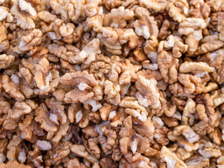 Pile of walnut kernels. Background texture from walnut kernelsの写真素材