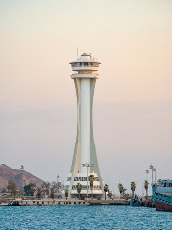 Aqaba, Jordan - 09.01.2021: Scenic view at sunset with Aqaba Port Observation or control Tower, Jordan. Lighthouse at sunsetのeditorial素材