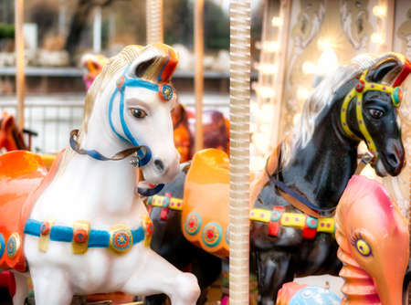 Close up detail with the horses of a carousel amusement rideの写真素材